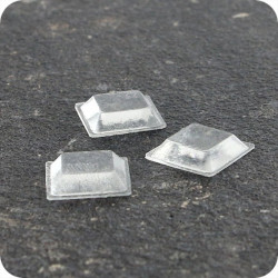 Lipnūs silikono kalneliai "Bumpons" 10 x 10 x 2,5mm, savilipiai, skaidrūs, trapecijos formos  (350vnt.)